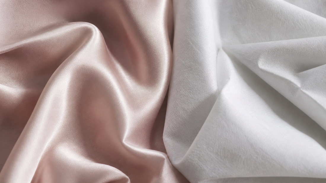 Fluid blush mulberry silk draped beside crisp white cotton showing texture contrast