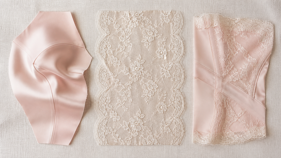 Flat lay of a moulded silk cup panel, a single sheer lace panel and a seamed lace and satin piece on cream linen