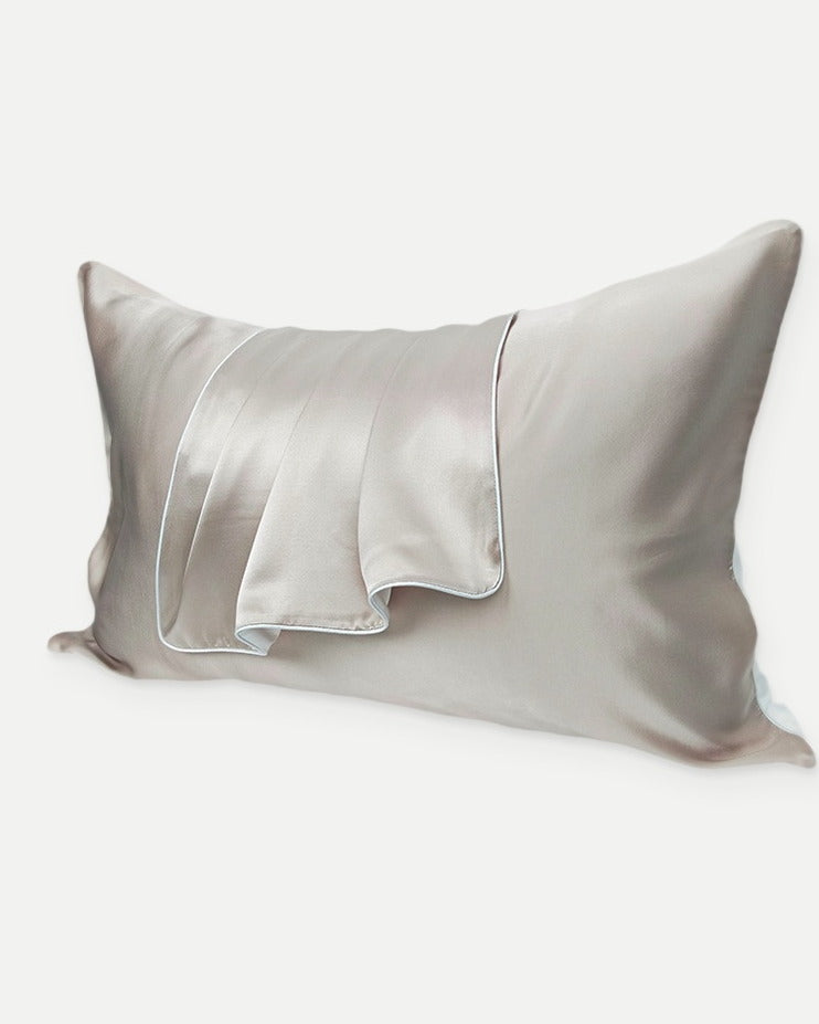 Darette Night Shift Silk Pillowcase in Crème - front view on a soft studio backdrop