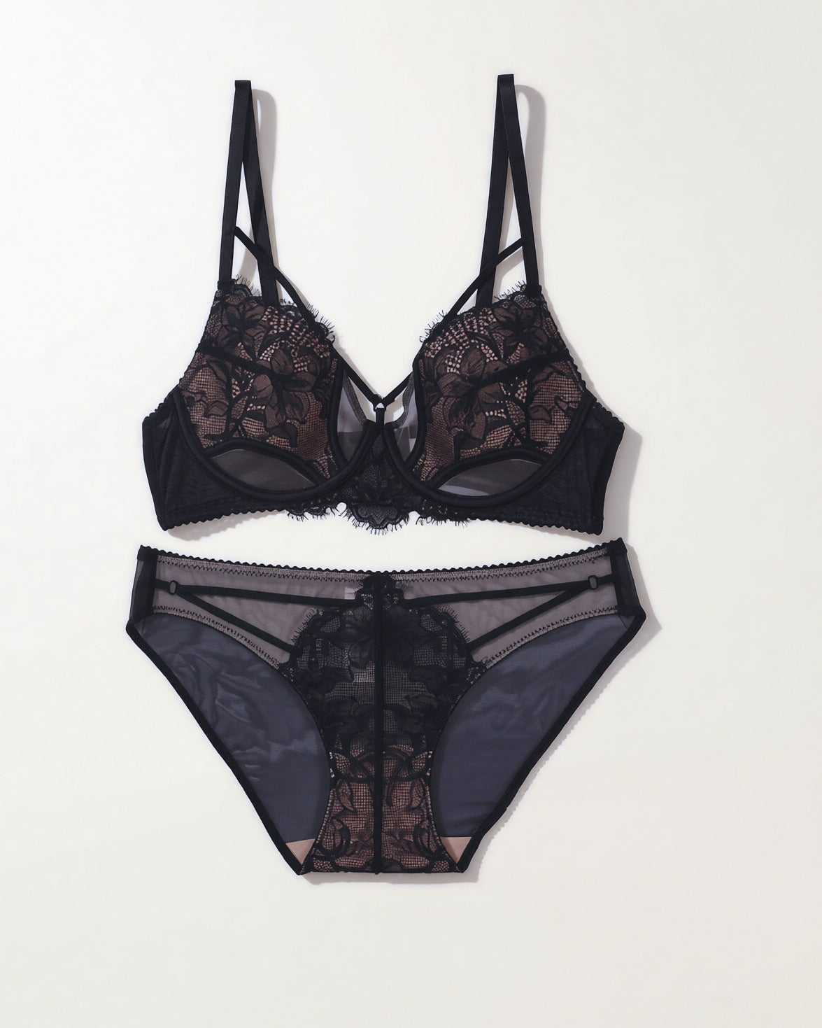 Flat lay of the Darette Quiet Yes Lace Set in Noir on a plain surface