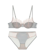 Flat lay of the Darette Second Skin Lace Set in Sage on a plain surface