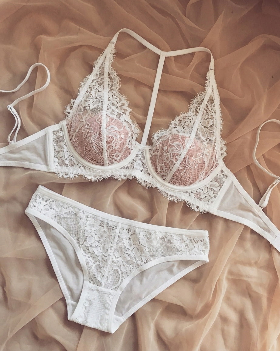 Candid lifestyle shot of the Darette Open Secret Halter Set in Ivory