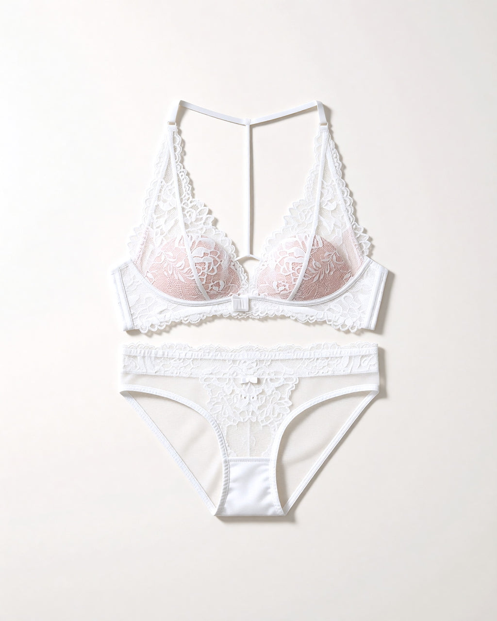 Flat lay of the Darette Open Secret Halter Set in Ivory on a plain surface