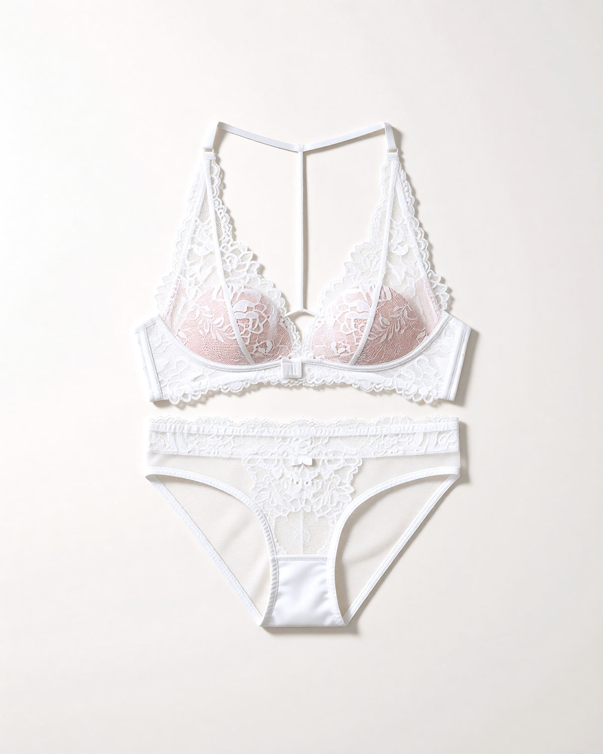 Flat lay of the Darette Open Secret Halter Set in Ivory on a plain surface