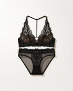 Flat lay of the Darette Open Secret Halter Set in Noir on a plain surface