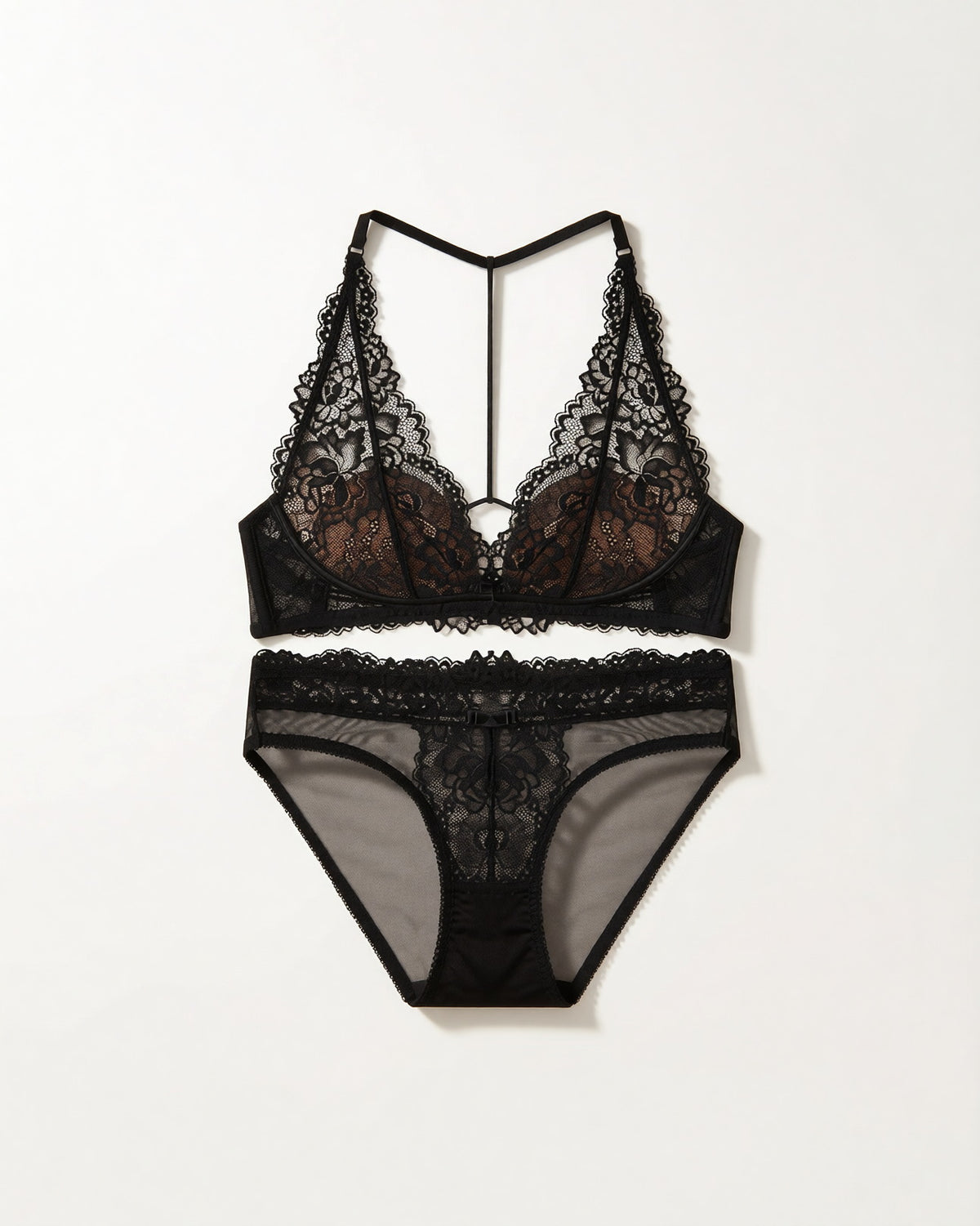 Flat lay of the Darette Open Secret Halter Set in Noir on a plain surface