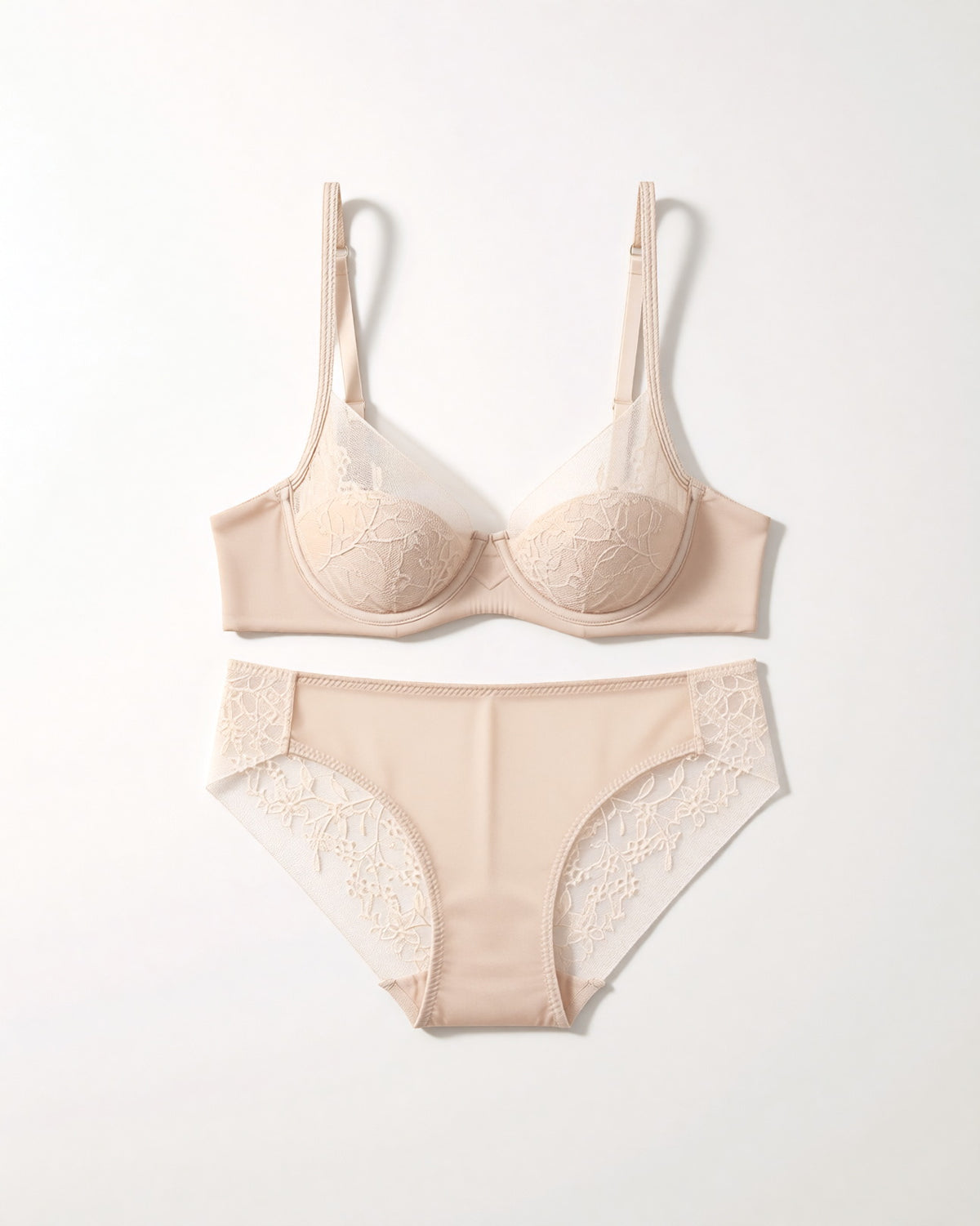 Flat lay of the Darette Good Habit Lace Set in Champagne on a plain surface