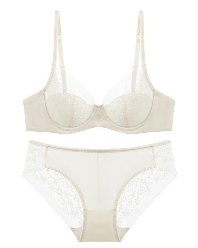Flat lay of the Darette Good Habit Lace Set in Blush on a plain surface