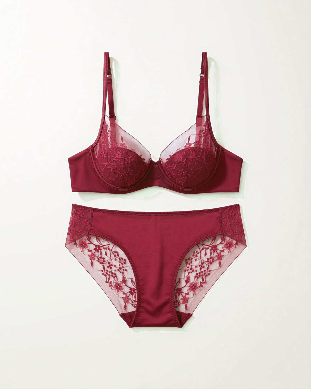 Flat lay of the Darette Good Habit Lace Set in Bordeaux on a plain surface