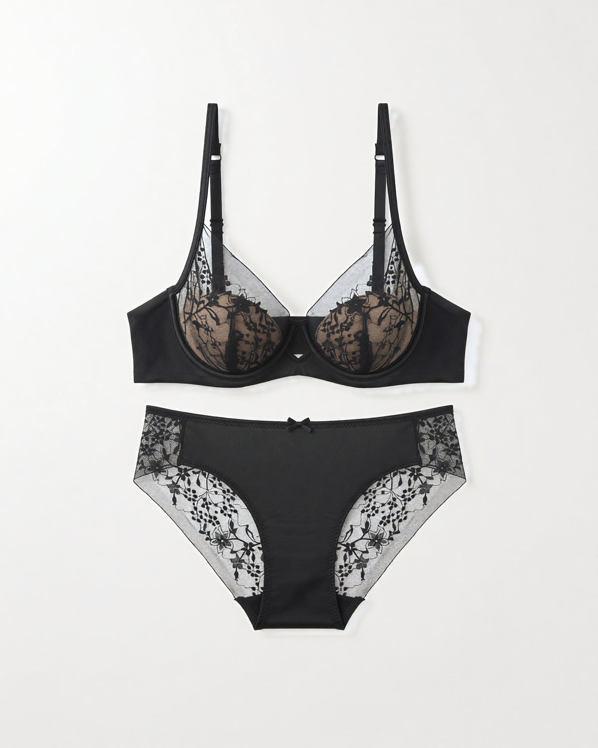 Flat lay of the Darette Good Habit Lace Set in Noir on a plain surface
