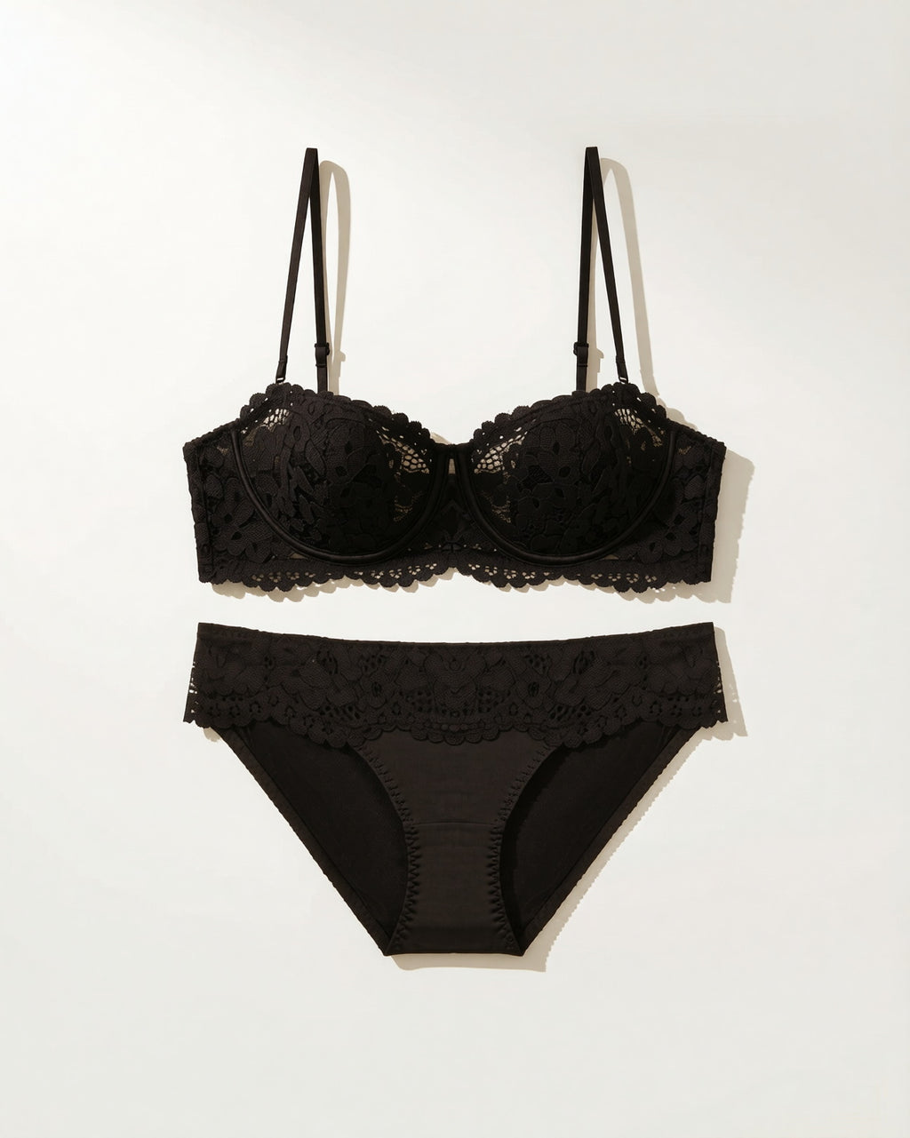 Flat lay of the Darette Half Truth Half-Cup Set in Noir on a plain surface