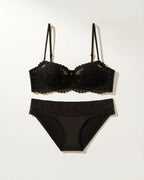 Flat lay of the Darette Half Truth Half-Cup Set in Noir on a plain surface