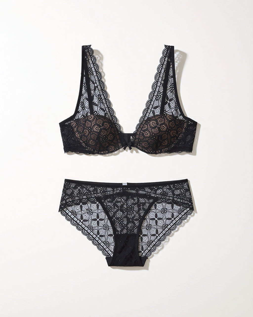 Flat lay of the Darette Soft Landing Lace Set in Noir on a plain surface