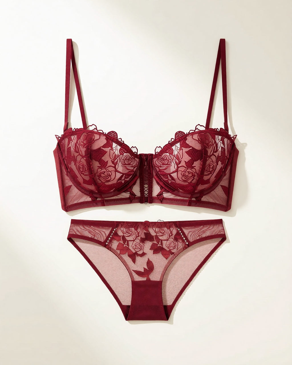 Flat lay of the Darette Slow Burn Lace Set in Bordeaux on a plain surface