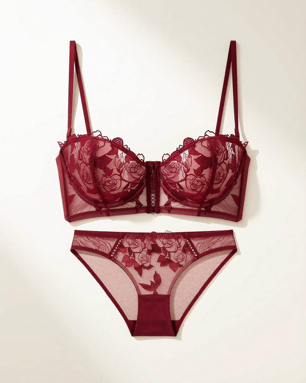 Flat lay of the Darette Slow Burn Lace Set in Bordeaux on a plain surface