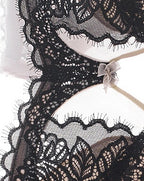 Close-up of the fabric and trim on the Darette The Confidante Lace Set in Noir