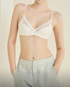 Model wearing the Darette Deep End Plunge Set in Champagne in soft indoor light