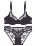 Flat lay of the Darette Deep End Plunge Set in Noir on a plain surface