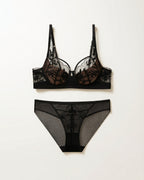 Flat lay of the Darette Sure Thing Lace Set in Noir on a plain surface