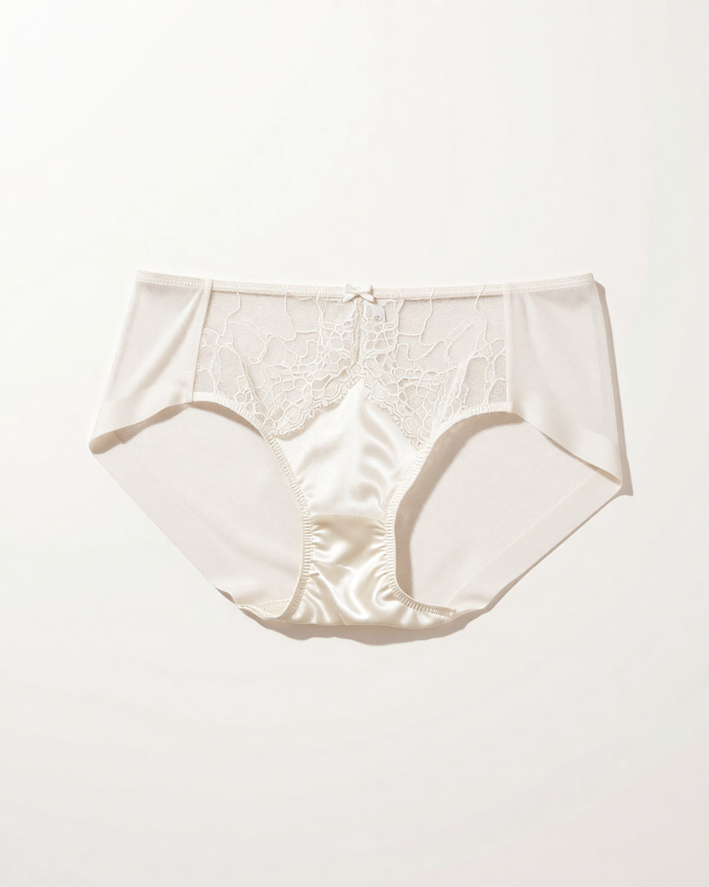 Flat lay of the Darette Bare Minimum Silk Set in Ivory on a plain surface