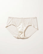 Flat lay of the Darette Bare Minimum Silk Set in Ivory on a plain surface