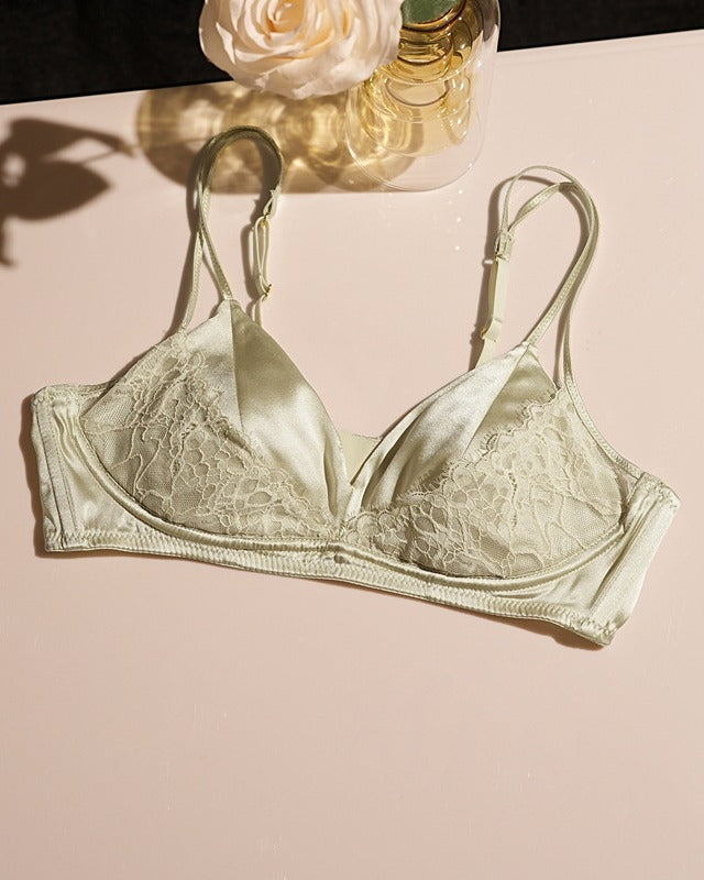 Flat lay of the Darette Bare Minimum Silk Set in Sage on a plain surface