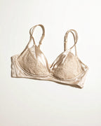 Flat lay of the Darette Bare Minimum Silk Set in Champagne on a plain surface