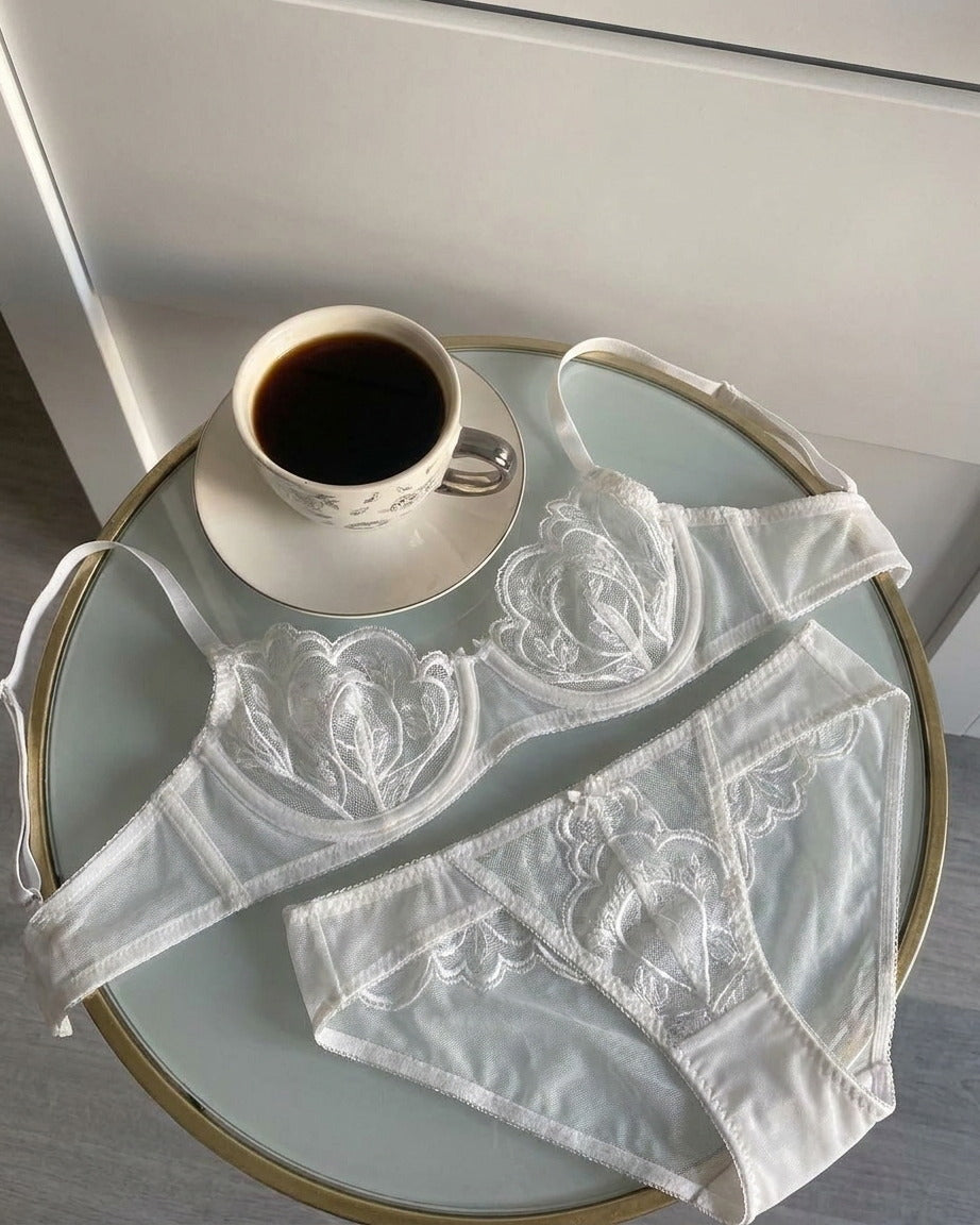 Candid lifestyle shot of the Darette Plain Sight Sheer Set in Ivory