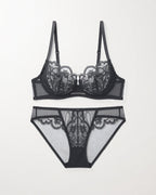 Flat lay of the Darette Plain Sight Sheer Set in Noir on a plain surface