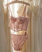 Candid lifestyle shot of the Darette After Hours Bustier Set in Blush