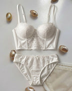 Candid lifestyle shot of the Darette After Hours Bustier Set in Ivory