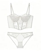 Flat lay of the Darette After Hours Bustier Set in Ivory on a plain surface