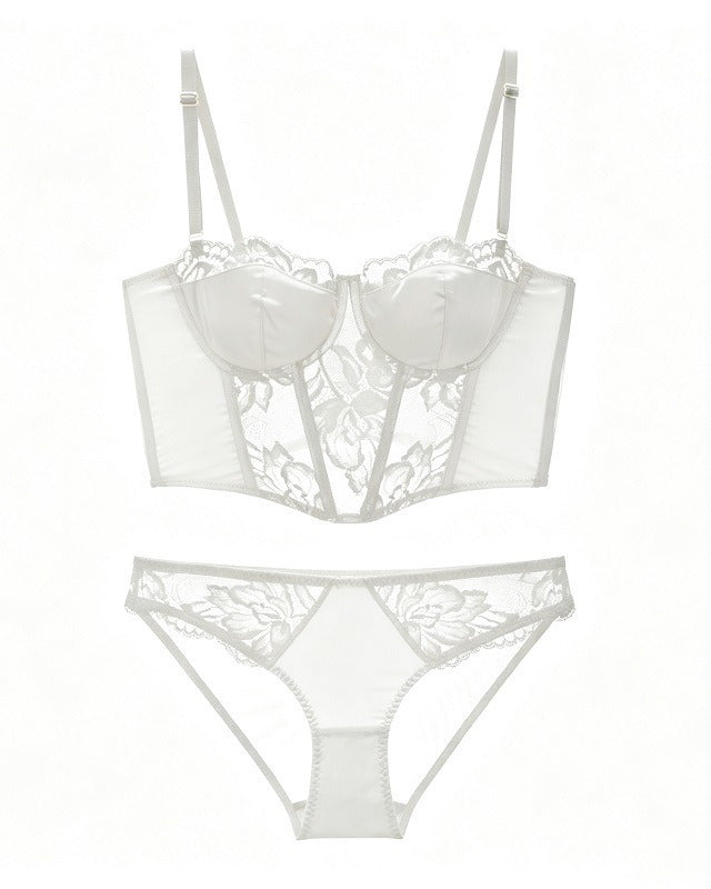 Flat lay of the Darette After Hours Bustier Set in Ivory on a plain surface