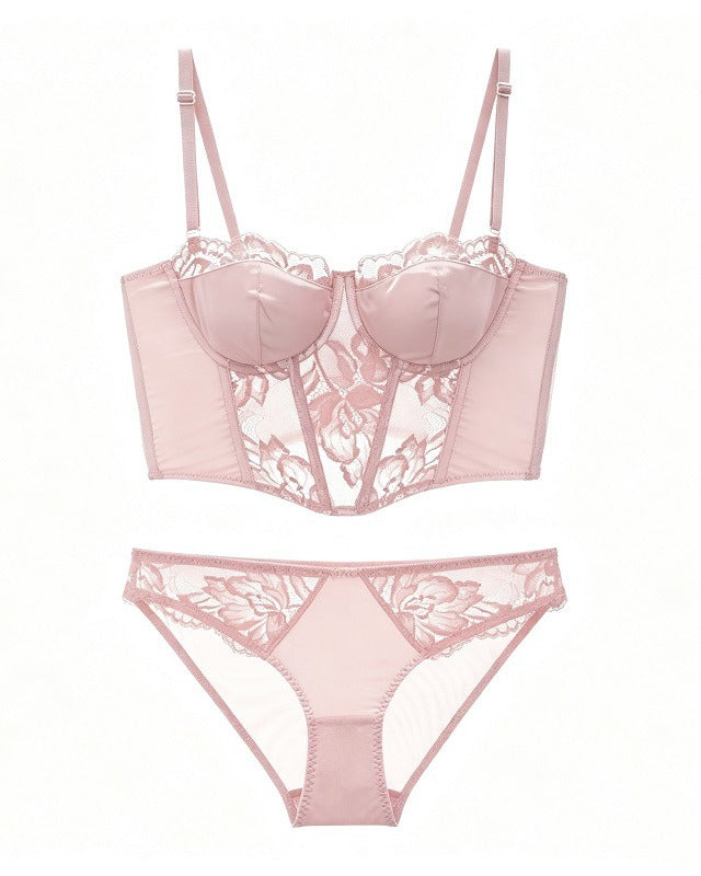 Flat lay of the Darette After Hours Bustier Set in Blush on a plain surface
