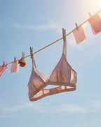 Candid lifestyle shot of the Darette Just Because Silk-Lace Set in Blush