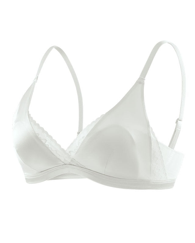 Flat lay of the Darette Just Because Silk-Lace Set in Ivory on a plain surface