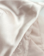 Detail shot of the Just Because Silk-Lace Set, showing the trim and stitching