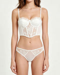 Darette After Hours Bustier Set in Ivory - front view standing in the lace bustier and panty set