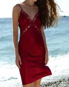 Darette Backhanded Silk Slip in Bordeaux - full-length front view on the beach