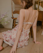 Back view of the Darette Built In Slip in Blush, showing the thin straps and floral ruffled skirt