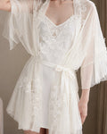 Darette Champagne Problems Satin Slip - front view standing in the satin slip with a sheer lace robe tied at the waist