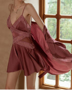 Darette Cool It Slip in Plum worn with the flowing robe, arms raised to show the crisscross lace bodice