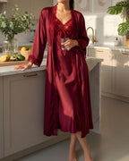 Darette Court of One Set in Bordeaux - satin robe and gown, standing in a kitchen with a glass of wine