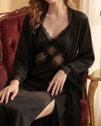 Darette Cover Story Set in Noir - sheer lace robe and slip gown, seated in a red velvet chair