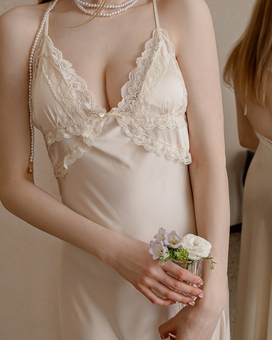 Close-up of the Darette First Light slip in Champagne - scalloped lace cups and thin halter straps