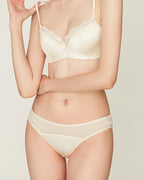 Close-up of the Darette Golden Hour Satin-Lace Set in Ivory - lace-trimmed bra and panty, side angle
