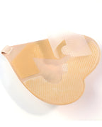Close-up of the Darette High Tide Covers in Nude - adhesive underside texture, angled view