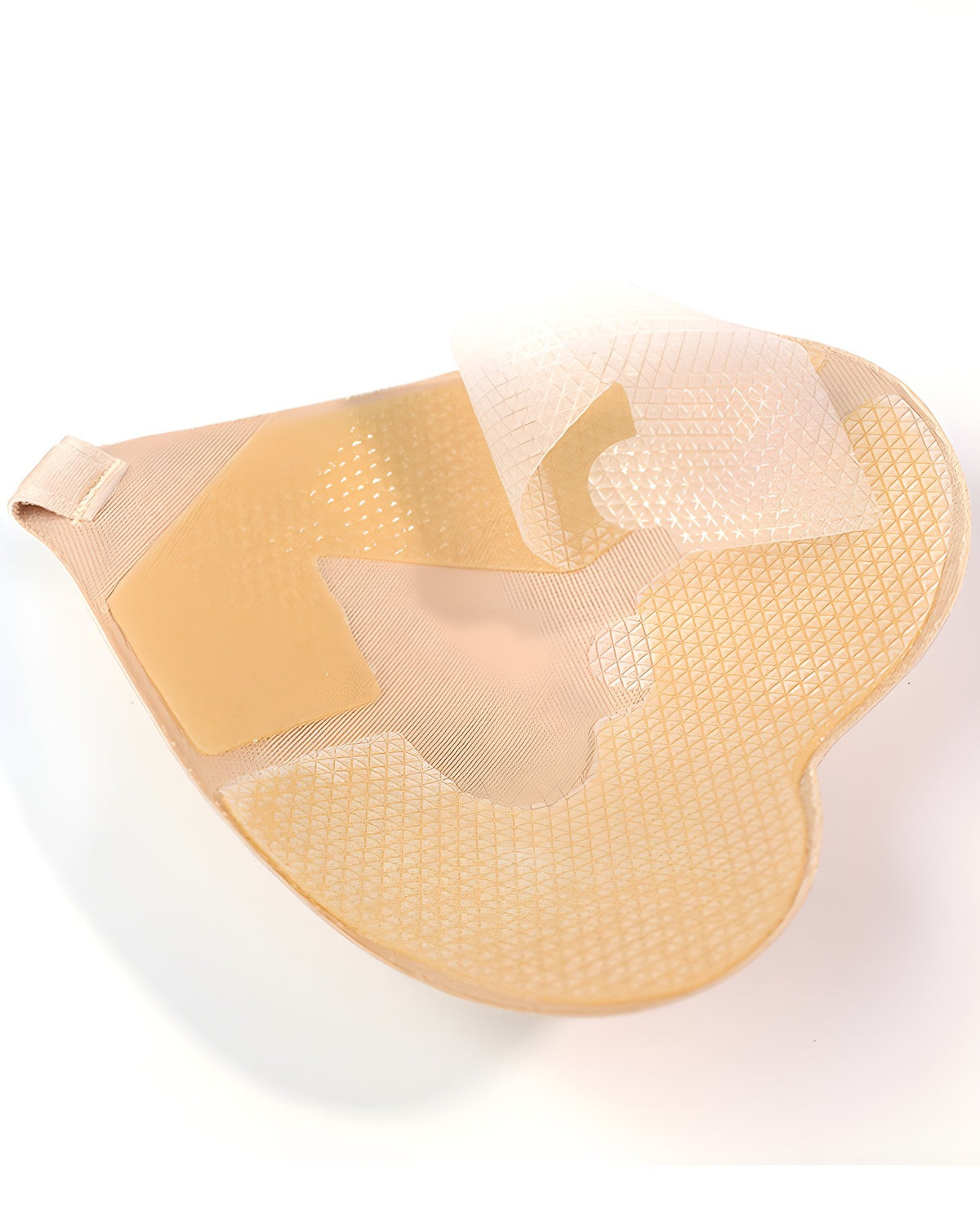 Close-up of the Darette High Tide Covers in Nude - adhesive underside texture, angled view