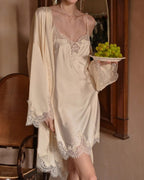 Darette Lash Line Lace Slip in Champagne - front view holding a tray of grapes with a matching robe