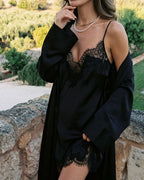 Darette Lash Line Lace Slip in Noir - close-up front view of the lace neckline with a robe over the shoulders